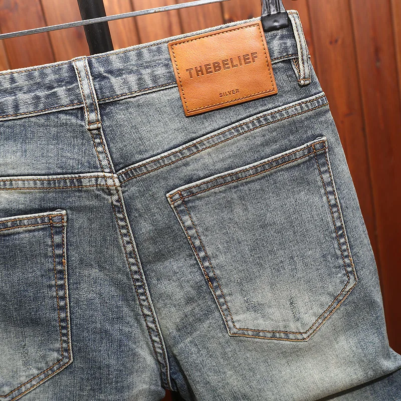 2025 men's clothing, cool and retro, with ripped patches and scraped denim shorts, men's trendy and fashionable cropped pants