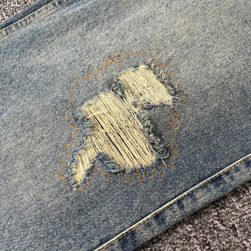 صور حقيقية Derschutze Street Retro Do Old Ripped Jeans التطريز الإلهي تمثال فضفاض عادية مستقيم الساق السراويل الرجال النساء