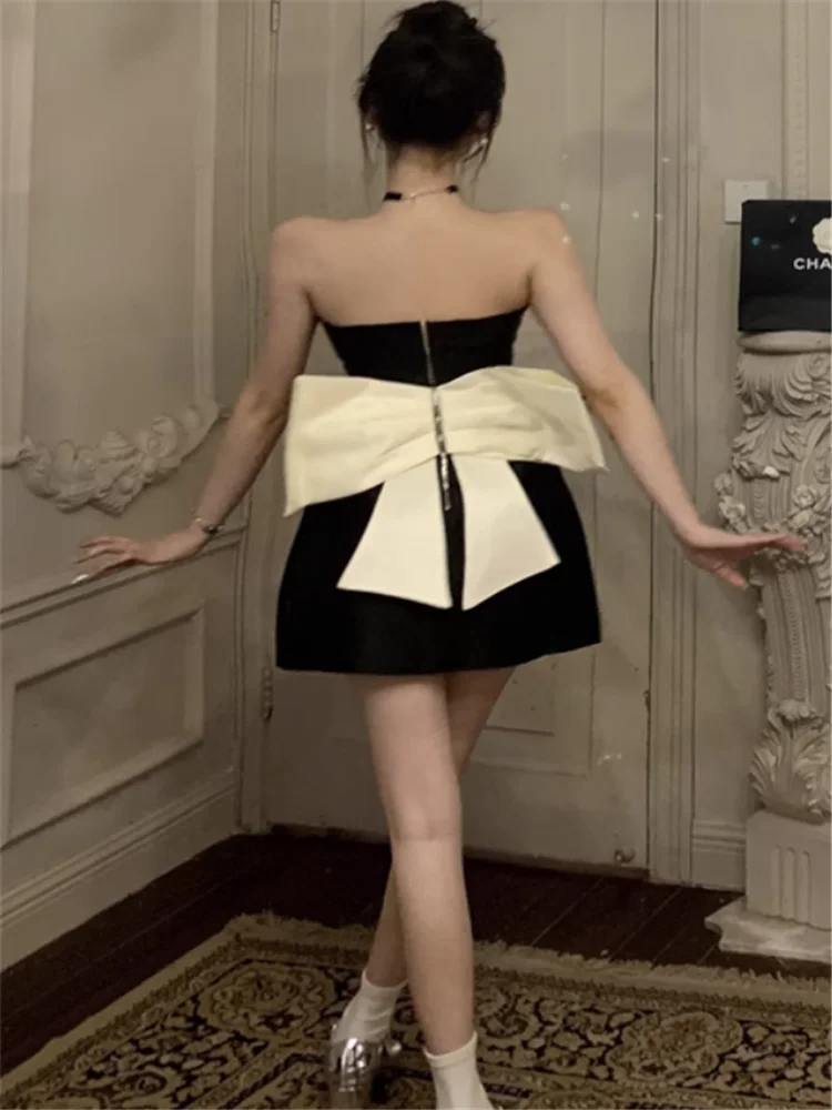 المشاهير سيدة الصيف القوس الكبير الظهر حمالة أسود فستان حفلة صغيرة بلا أكمام المرأة الجوف الخصر قلم رصاص قصير فستان عيد ميلاد