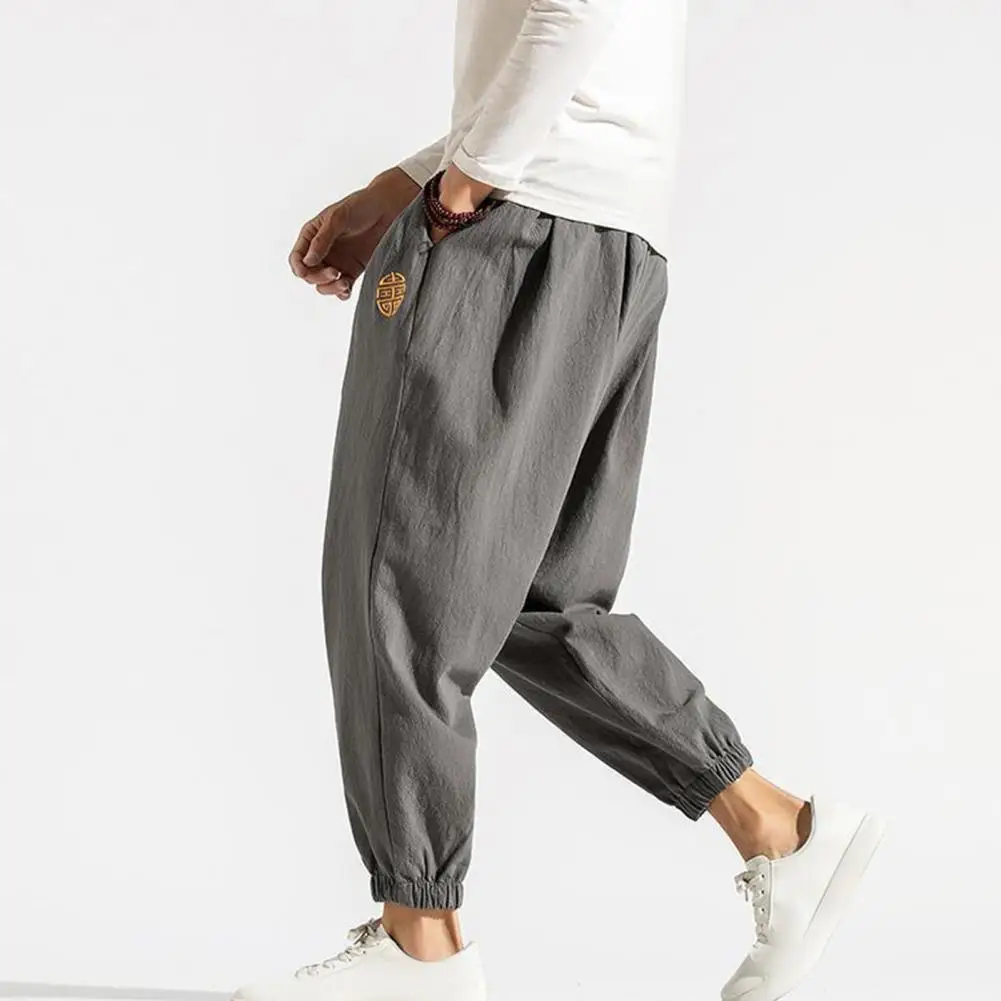 Calça masculina com faixas de tornozelo estilo chinês com bolsos bordados, elástico na cintura, casual solta, macia, respirável, primavera