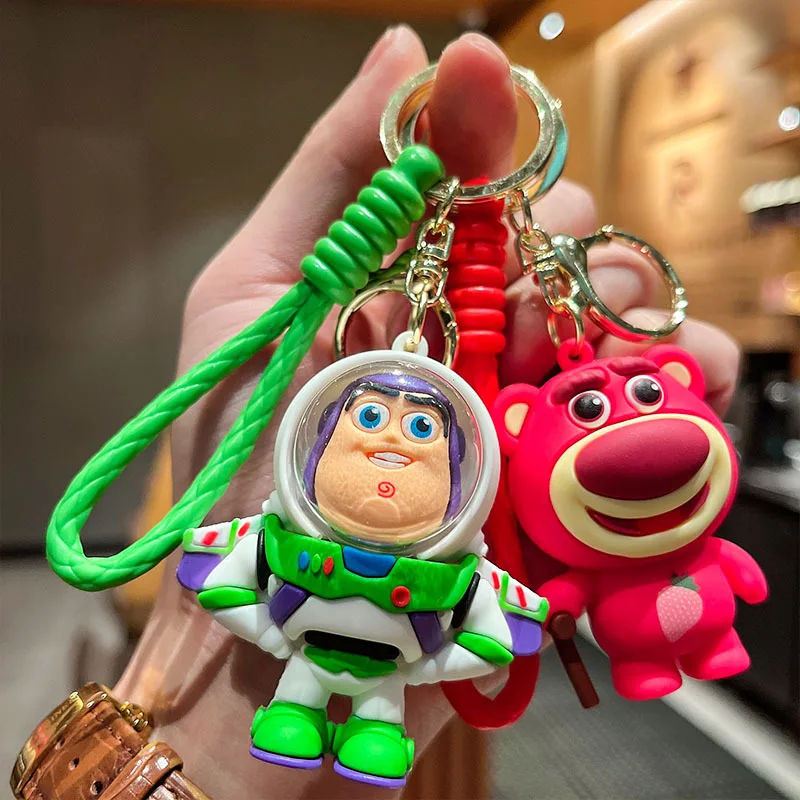 Cute Cartoon Toy Story Buzz Lightyear Keychain PVC Doll Strawberry Bear Couple Luggage Pendant Car Keychain Children's Toy Gift