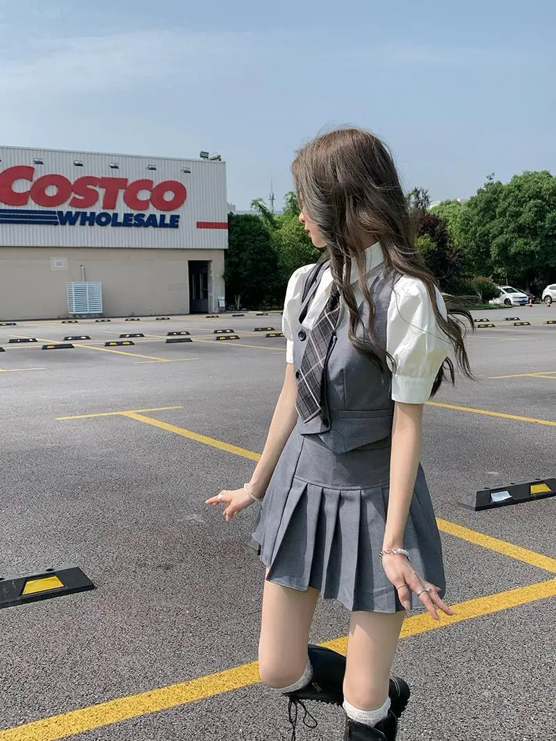 2025 été nouvelle mode femmes corée uniforme style jk robe ensemble gilet chemise courte plissée a-ligne jupe trois pièces jk ensemble