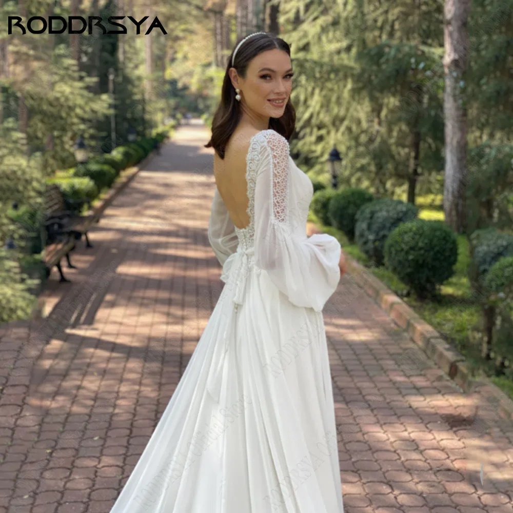 RODDRSYA Boho V-hals Chiffon Bruidsjurk Plus Size Backless Lange Puff Mouwen Kant Bruidsjurk A-LiRODDRSYA Boho V-hals chiffon trouwjurk plus maat rugloze lange pofmouwen kant bruidsjurk A-lijn grote maat Düğün elbisesi