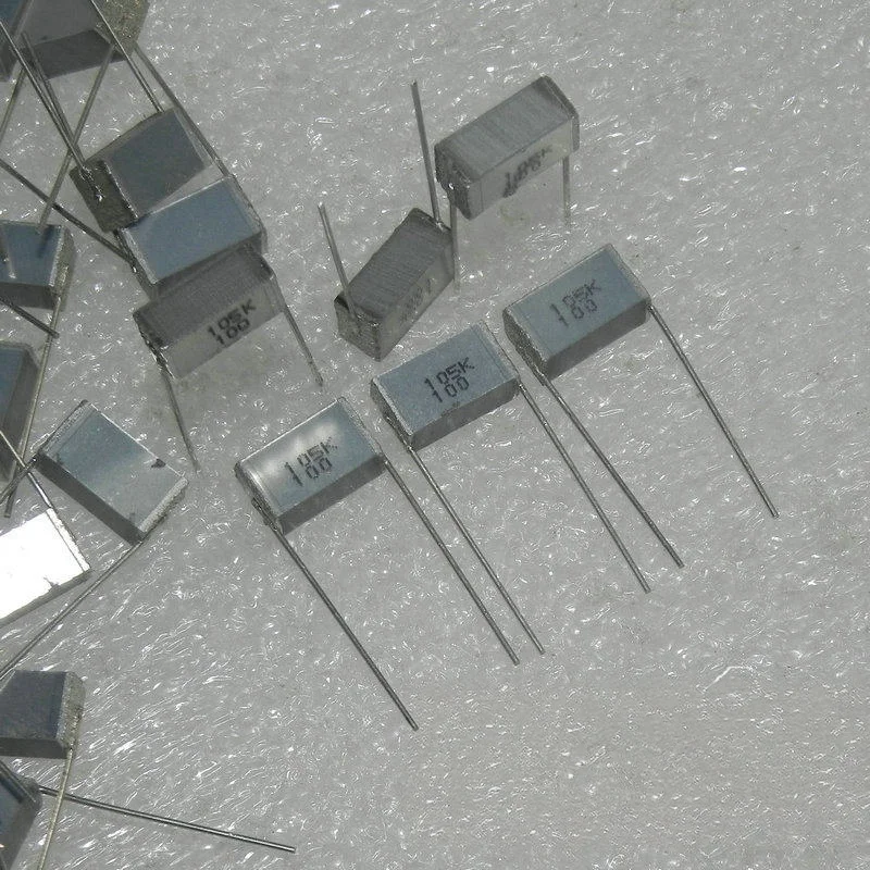10/50PCS Original 100v 1UF 105k 105j laminated multi-layer cake coupling non-inductive electrical foot spacing 5MM/10MM/15MM