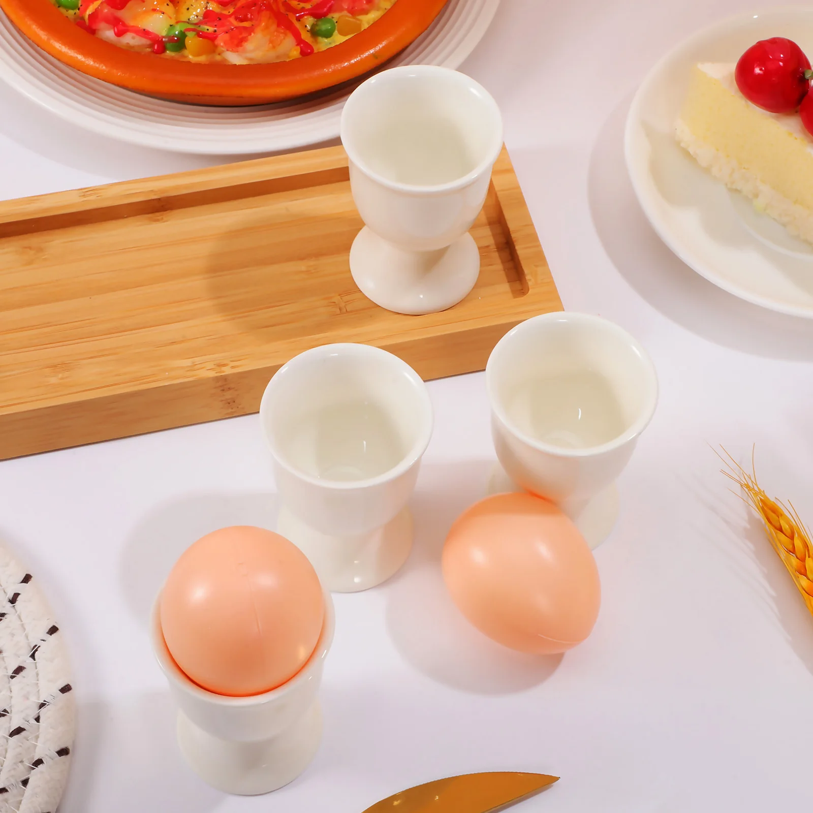 

4Pcs Ceramic Egg Cups Stylish Boiled Egg Cup Holder Non-Porous Easy Clean Countertop Storage Container for Breakfast Afternoon