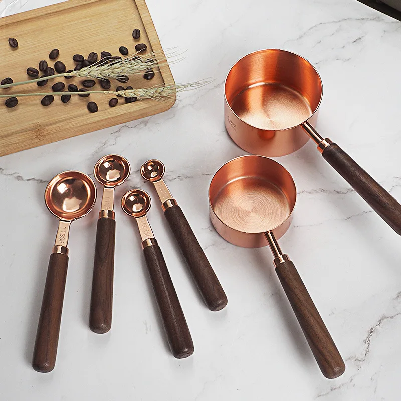 

Stainless steel measuring cup measuring spoon set rose gold baking appliance with walnut handle Graduated baking measuring spoon