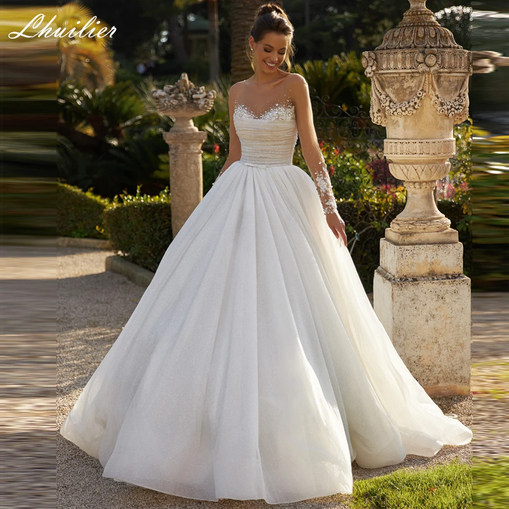 

Lhuillier Индивидуальные свадебные платья трапециевидной формы с круглым вырезом и бисером, плиссированное блестящее свадебное платье из тюля со шлейфом часовни