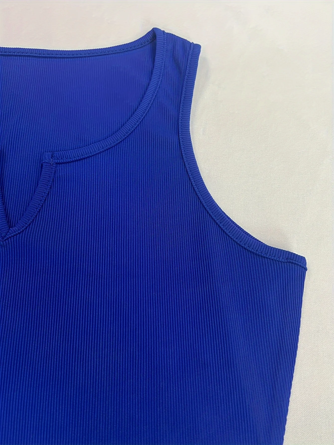 Versatile, fashionable, solid color, sexy V-neck vest with a herringbone women\'s top underneath