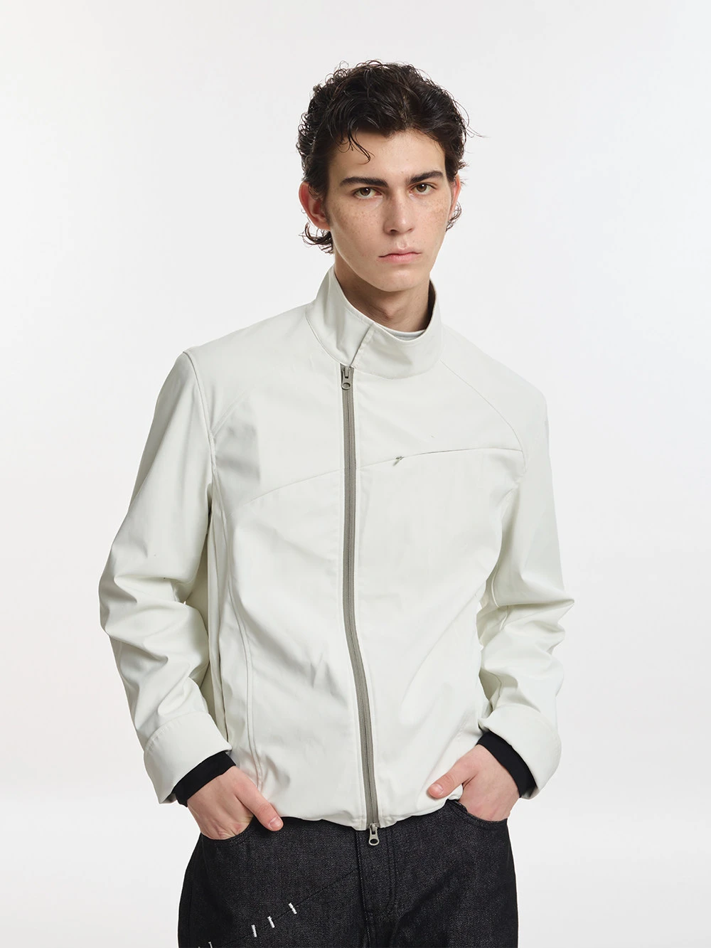Unisex jacket with foldable sleeves, slanted zipper, and stand-up collar