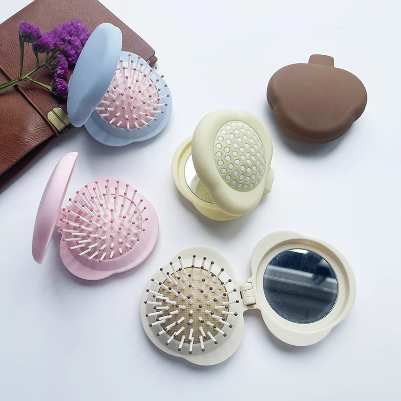 مشط شعر صغير محمول مع مرآة لصالونات تصفيف الشعر، فرشاة شعر صغيرة الحجم قابلة للطي للتدليك 2 في 1، مشط وسادة هوائية