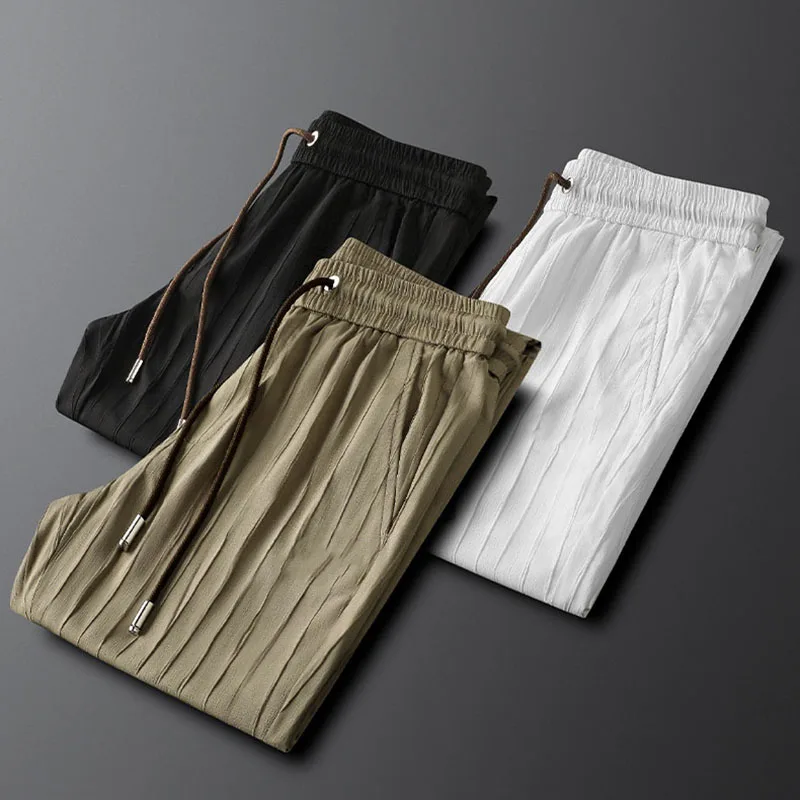 

Quality handsome vertical striped men's casual sports pants slim slim feet summer thin stretch sweatpants men