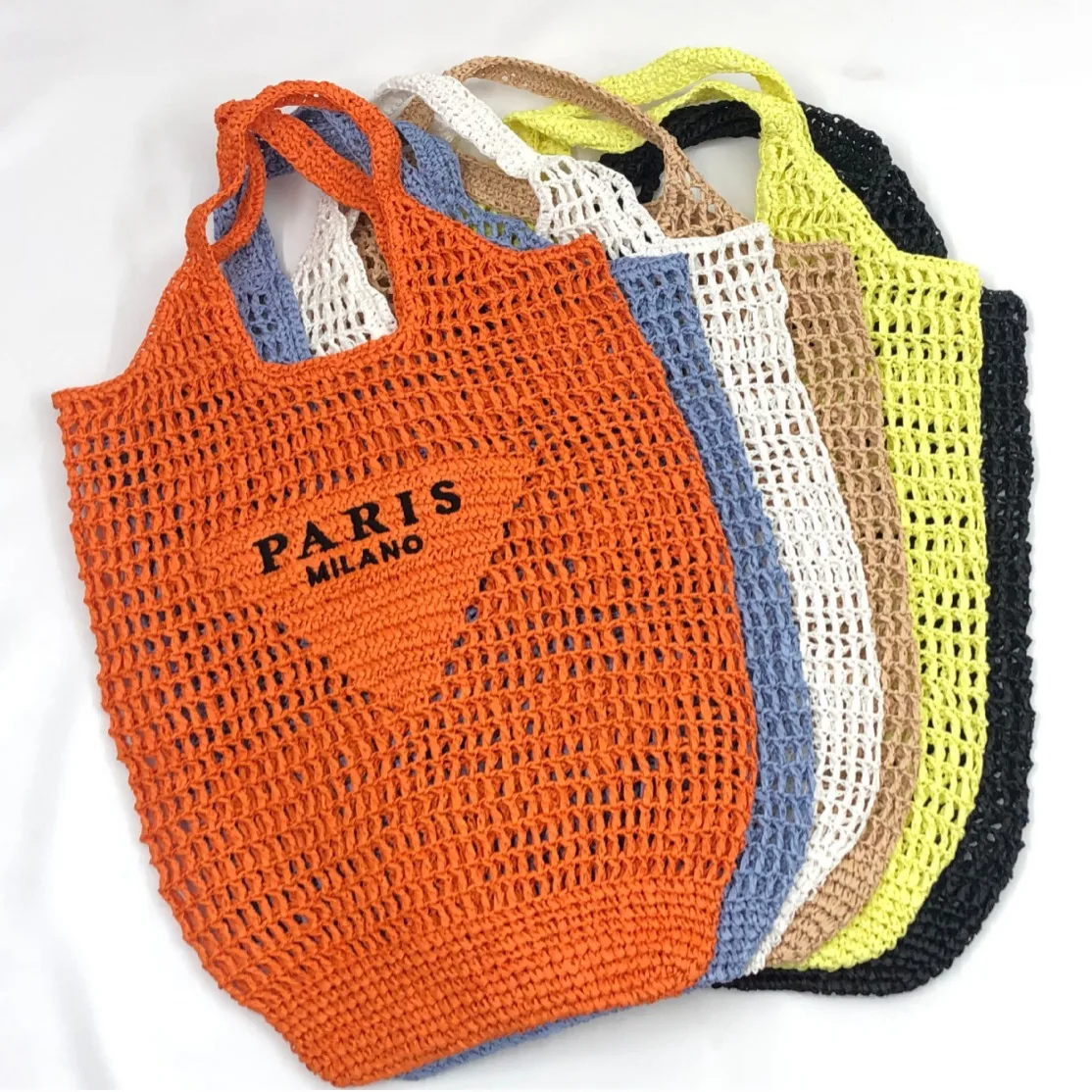 Spring and summer hollowed-out one-shoulder tote bag embroidered letter paper rope straw woven bag women\'s portable beach bag