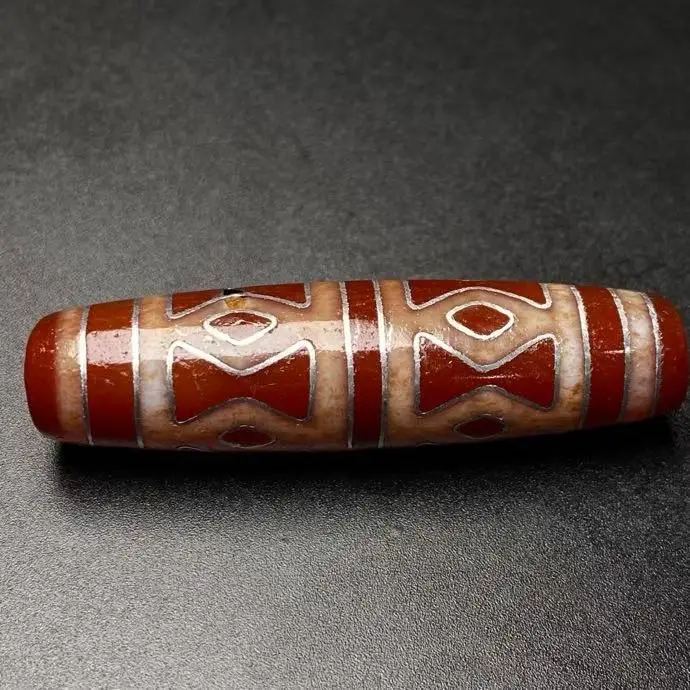 Antique high-oil patina with silver-thread inlays and eight-eyes vajra beads