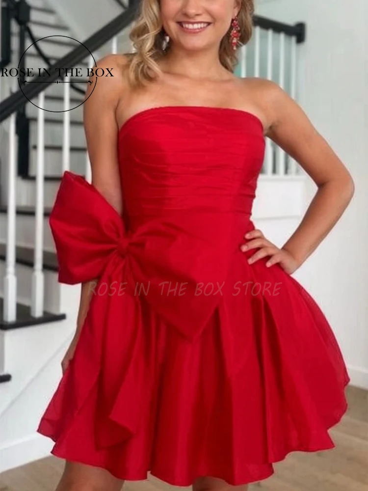 

ROSEINTHEBOX Red Starpless Teens' Homecoming Dress with Pleated Bodice and Bow on Waistline Satin Cocktail Prom Dresses Custom