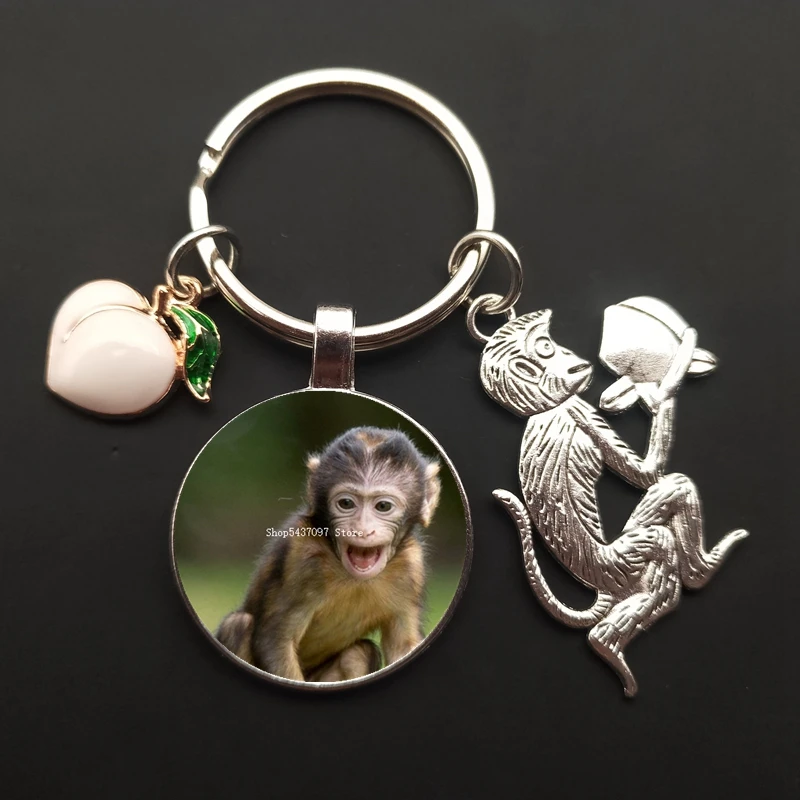 Monkey charm keychain monkey painted glass cabochon car bag ornaments peach keychain men and women souvenirs