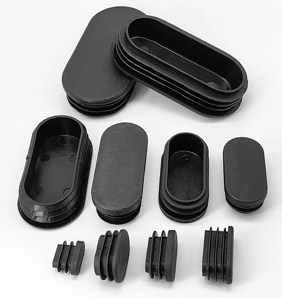 

Black/White Oval Plastic Rectangular End Cap Tube Insertion Plug Table And Chairs Dan Shaped Foot Plug Decorative Dust Cover