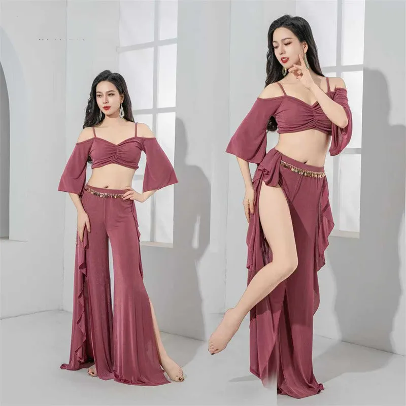 2025 Vestito da danza del ventre da donna Costume da spettacolo teatrale Manica lunga con volant Gonna con spacco laterale Pantaloni a vita alta Cintura da spettacolo per ballerini di squadra