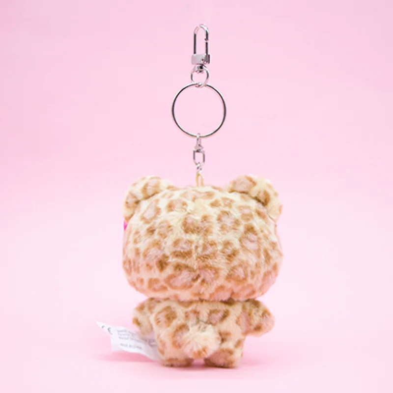 Miniso sanrio olá kitty boneca de pelúcia saco ornamentos rosa e amarelo latte pele escura saia leopardo padrão chaveiro bonito arco-nó