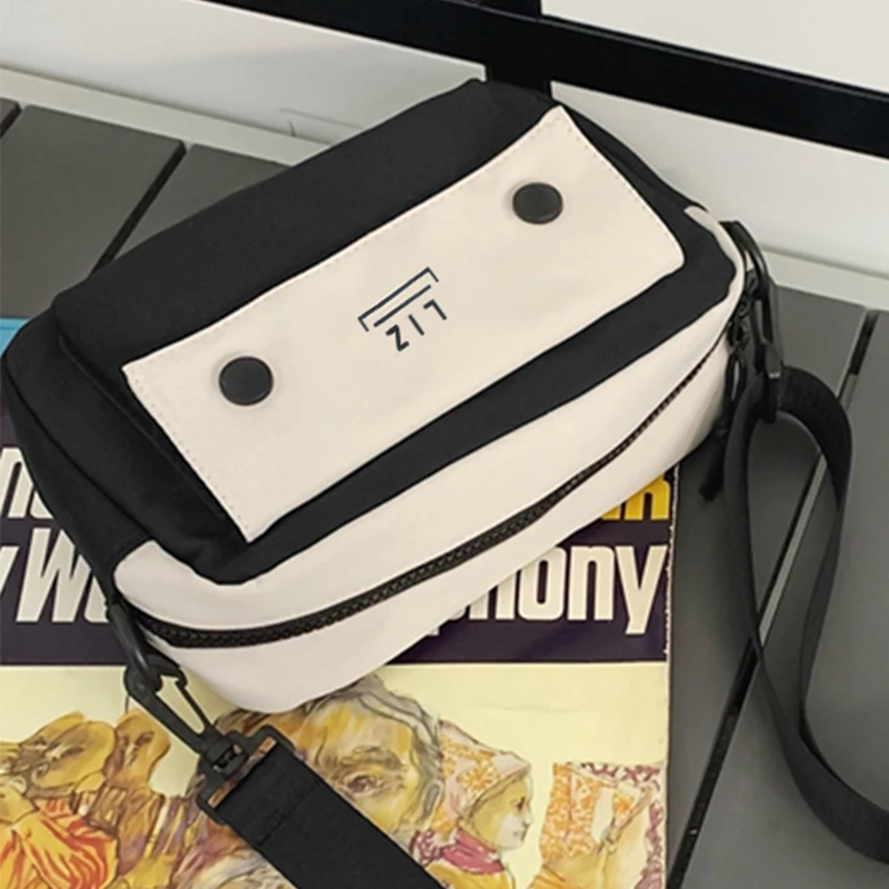 

Neutral style backpack for men and women, with cartoon design, suitable for business trips and photography.