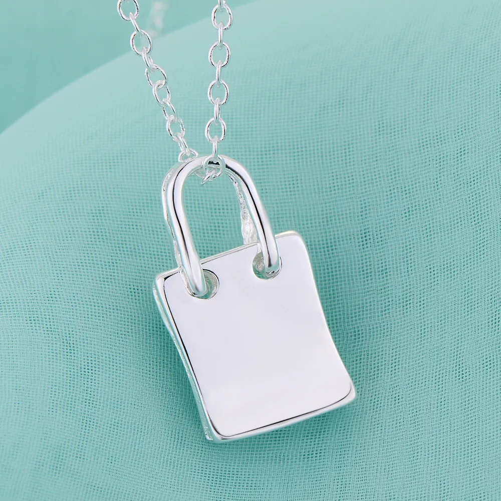 Neue 925 Sterling Silber Halskette mit Handtaschen-Anhänger für Damen Hochzeitsschmuck Luxuriöser Modestil Verlobung Hochwertige Geschenke