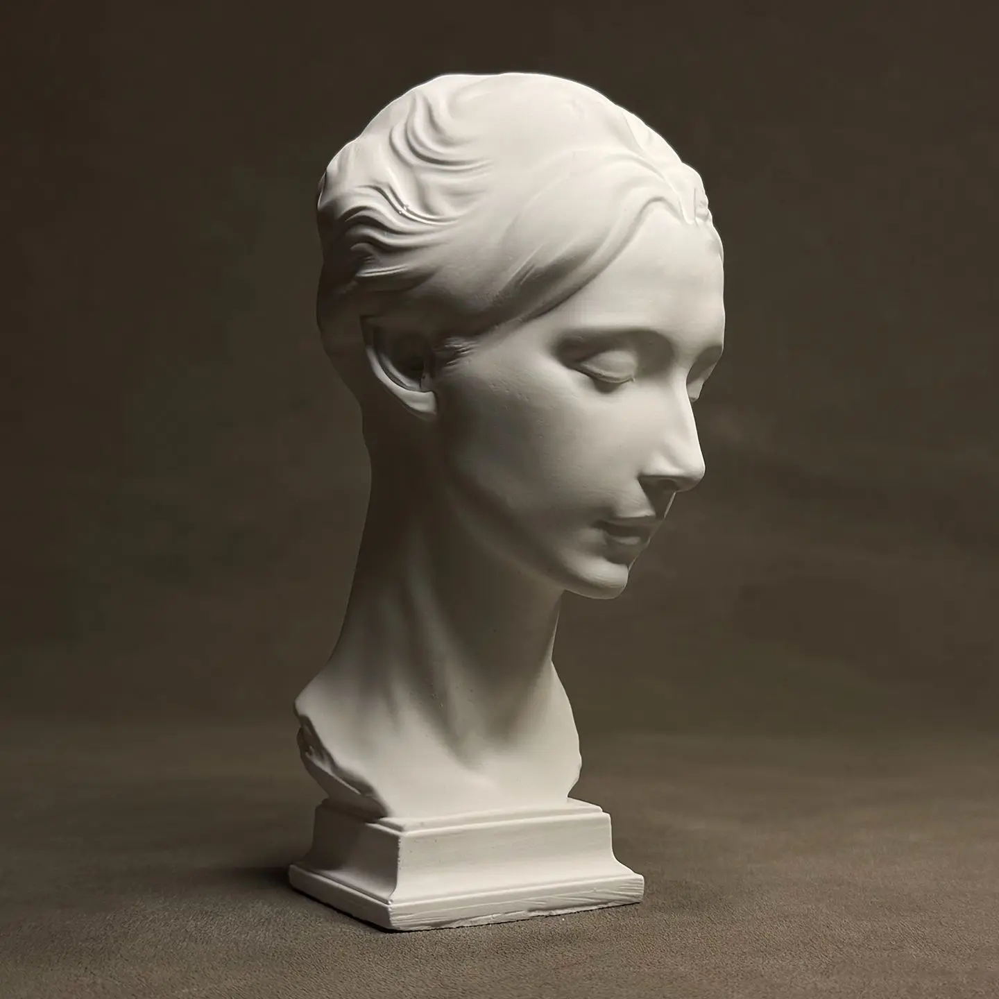 Renaissance master Cellini's work 'Italian Girl' recreates a plaster head as a desktop Art Deco ornament