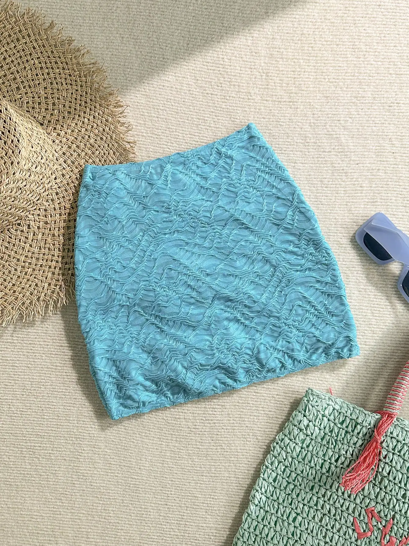 

Женская тюркоазовая юбка-халат с драпировкой и декором в виде морских звезд для пляжного отдыха