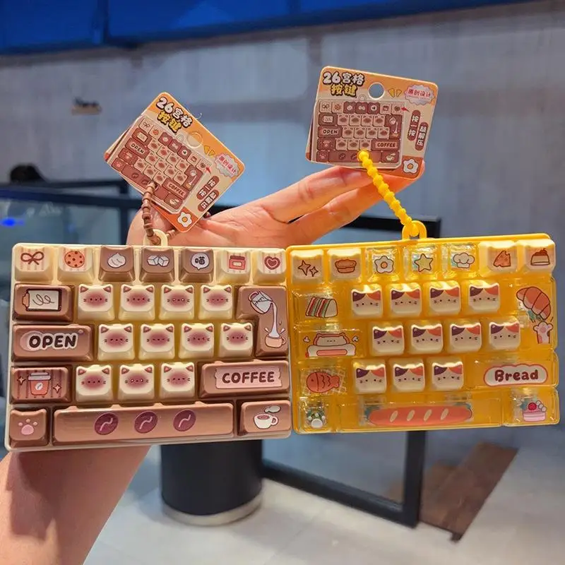 @*Clickable Cat Pudding Decompression 26-Key Keyboard Cartoon Fidget Toy Backpack Pendant for Stress Relief On The Go