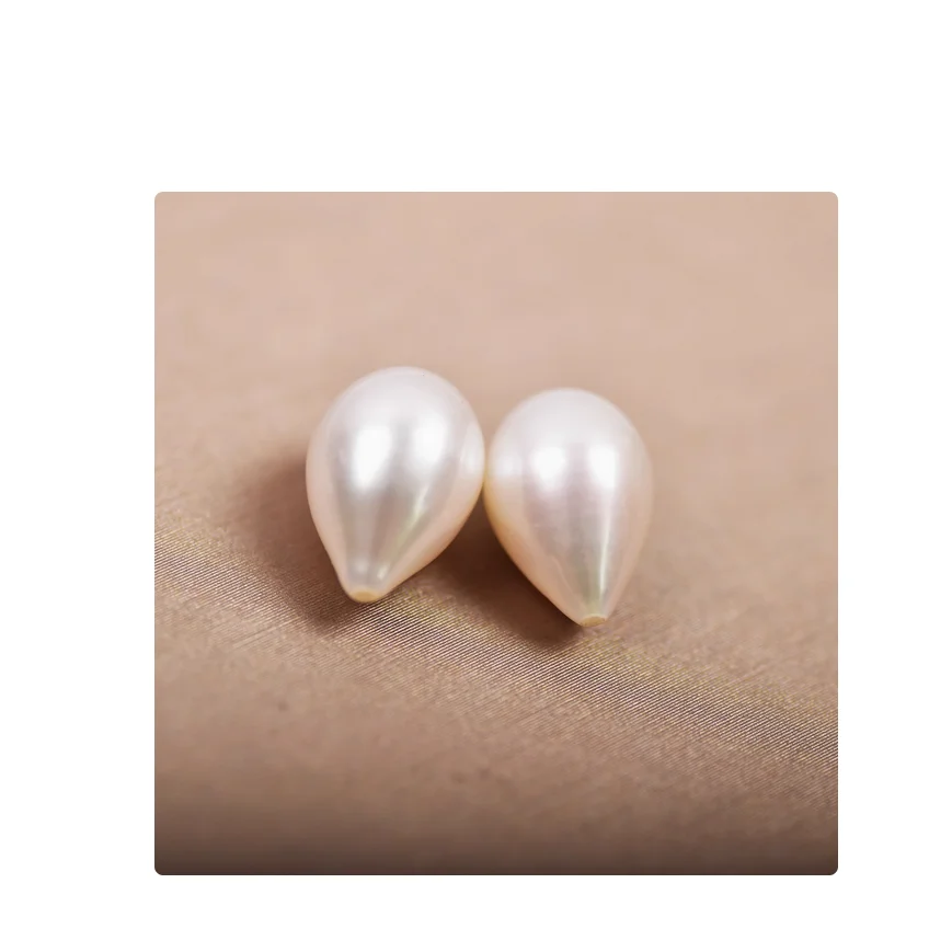 PAIR OF 10X16MM SOUTH SEA WHITE CULTURED PEARL HALF DRILLED