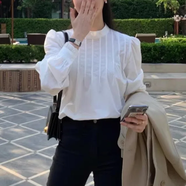 

Стильная однотонная женская рубашка с длинным рукавом, воротником-стойкой и одной пуговицей, универсальная, осенняя, модная, элегантная.