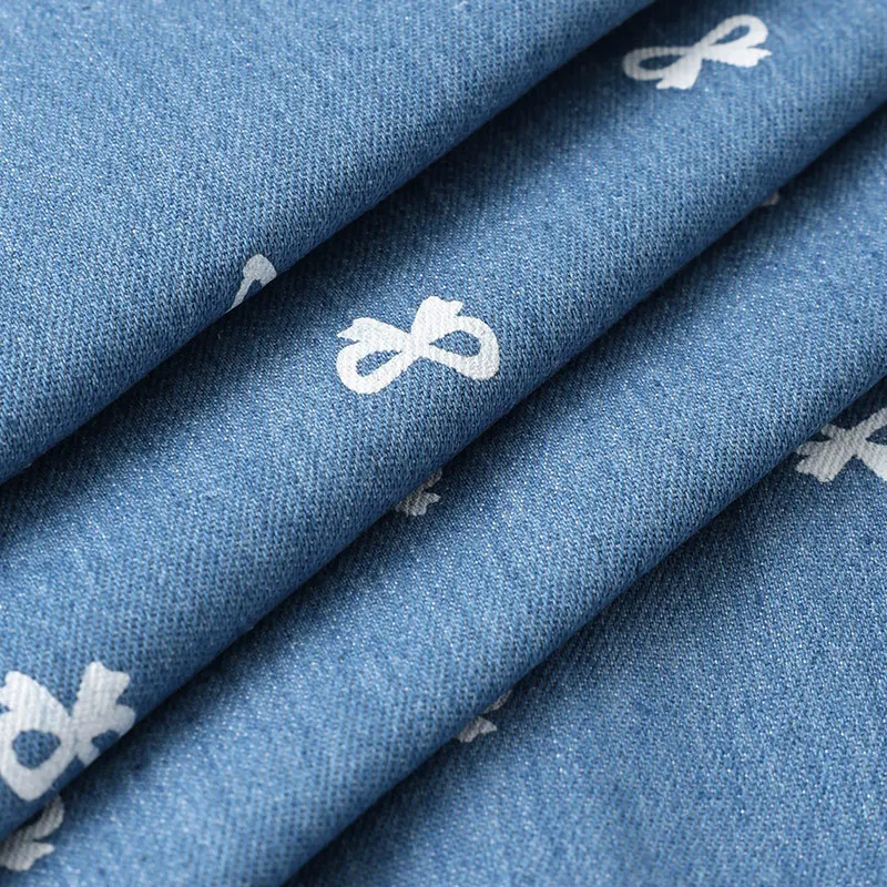 0.5m/1m/2m Low Elasticity Washed Cotton Denim Fabric Bow Print Fabric for Pants, Dresses, Bag Handmade DIY Clothing Fabrics