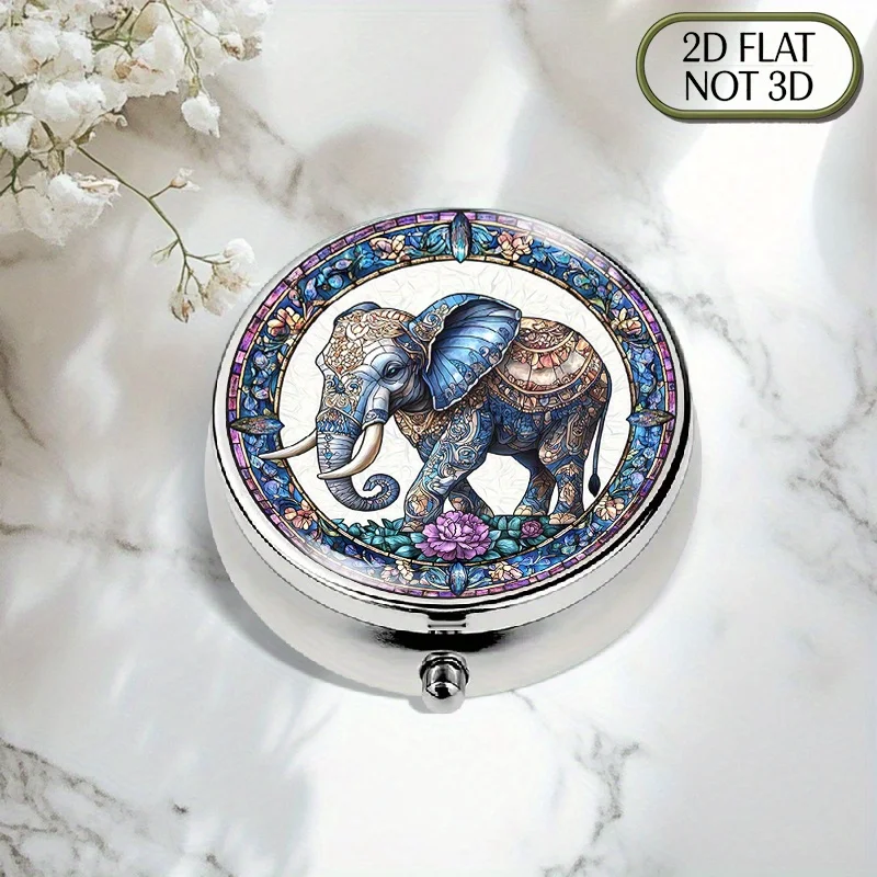 A flat, portable, round metal pill box, adorned with majestic Indian elephant and floral patterns, is designed for organized and stylish medication storage. It is suitable for organizing vitamins, multi-purpose items, small objects, coins, travel and sports supplies. Flat design