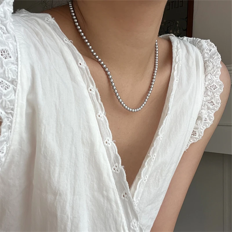 2024 New Fashion Women\'s Grey Round Glass Pearl Sweater Chain Necklace Beaded Clavicle Necklace Wholesale