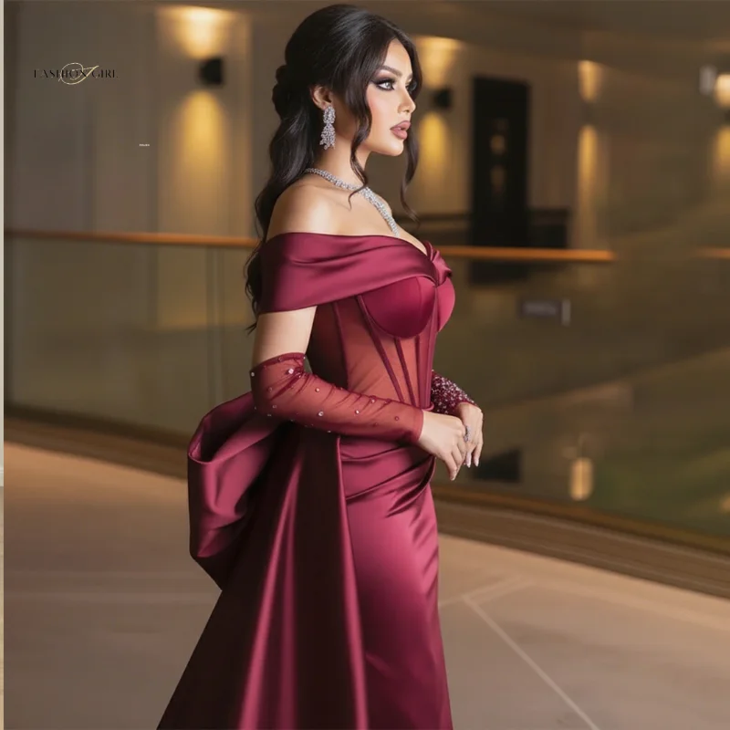 Abito da ballo stile sirena tinto rosso vino bordeaux con gonna lunga con spalle scoperte con fiocco e abbellimenti di perline lucide sulle maniche