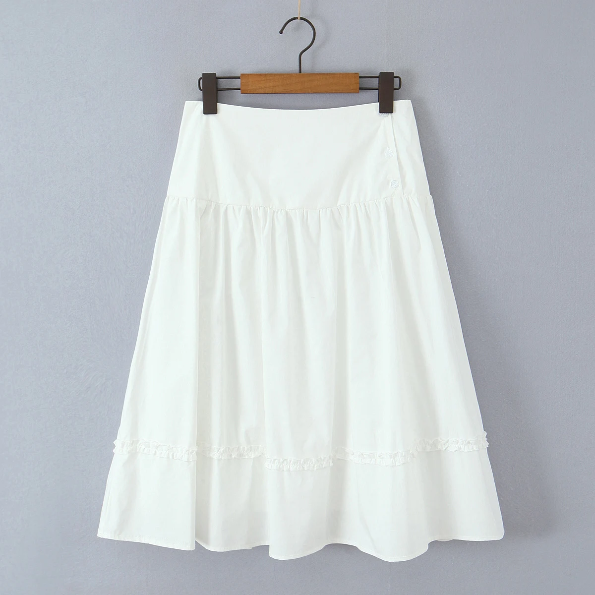 Novo 2025 botões de férias cintura baixa midi saia longa feminina emendado orelhas de madeira balanço saias forradas boho amarelo branco