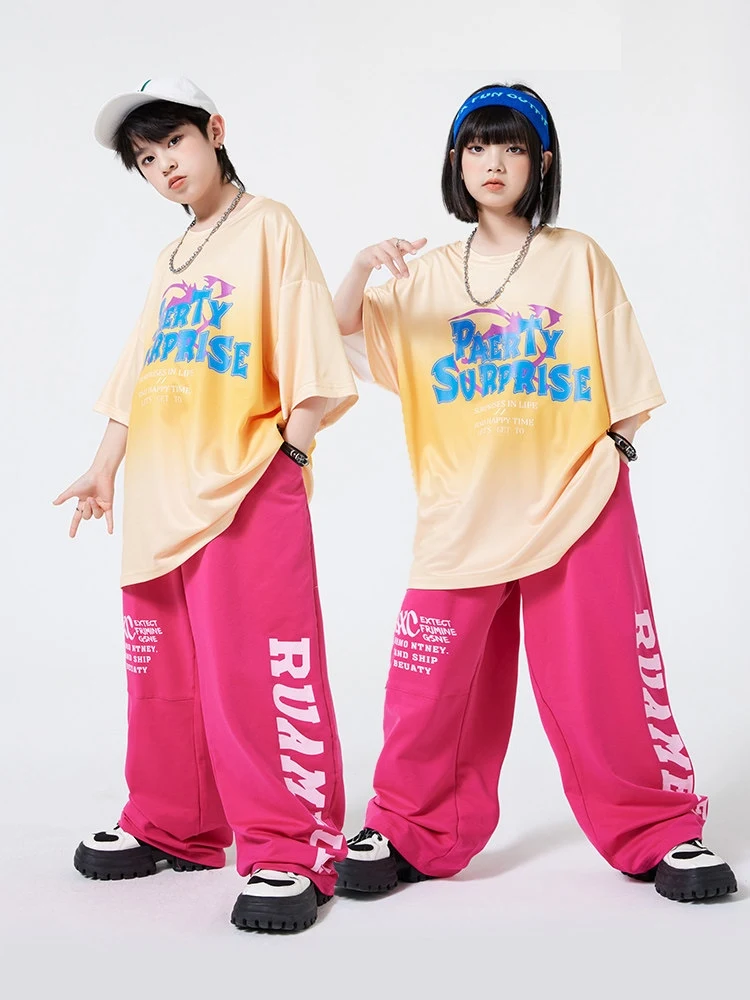 

2026 Kids Hip Hop Clothing Yellow T Shirt Pink Sweatpants Short Sleeves Loose Practice Clothes Boys Gilrs Jogger Outfits BL15128