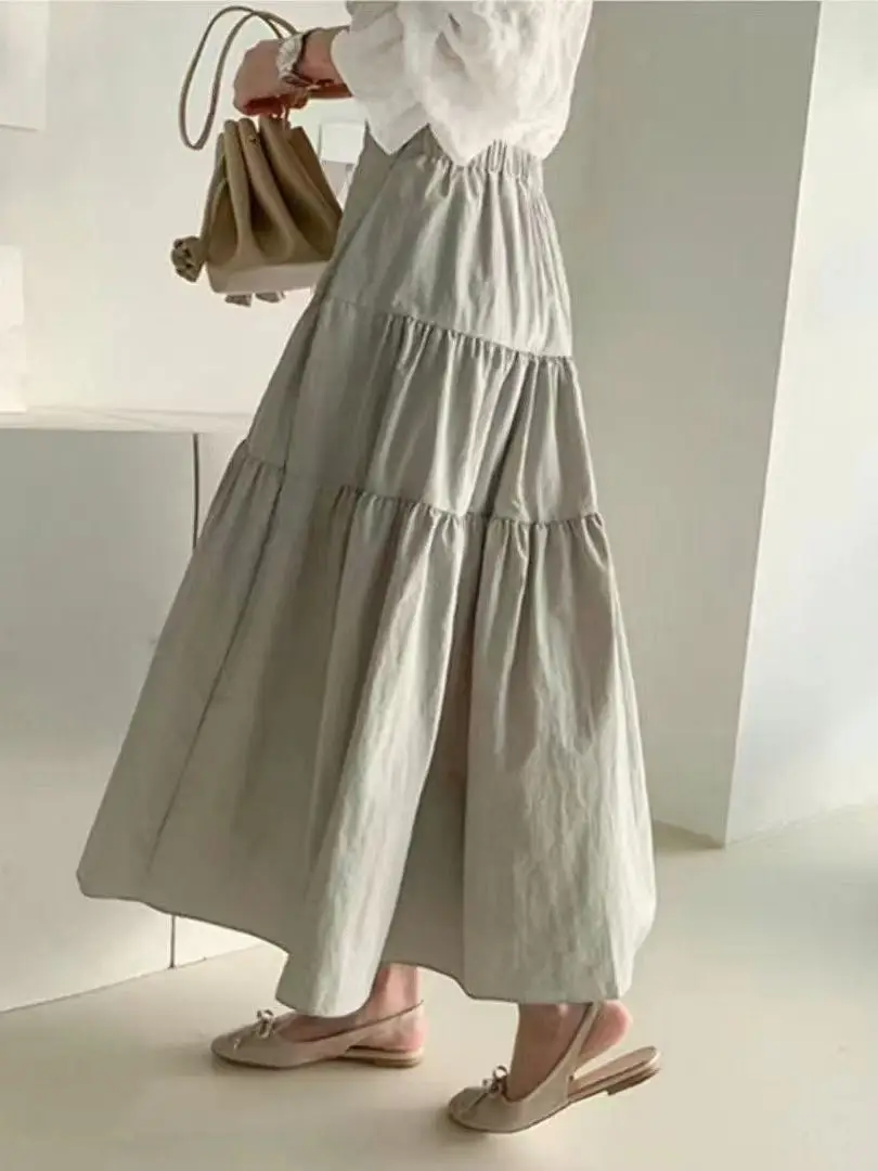 Saia midi psada fena com mangas sino, cintura elástica, modelagem alta, longa, de aodão, cor sólida, estilo casual p...