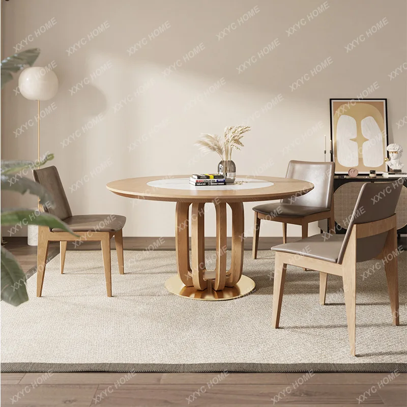 

Круглый обеденный стол из массива дерева со встроенным поворотным механизмом, в стиле ваби-саби, для небольших квартир.