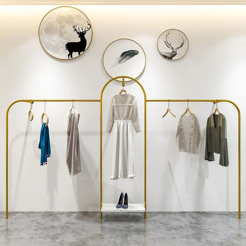 Custom, wall mounted gold metal hanging rack for clothing store showroom display stand furniture