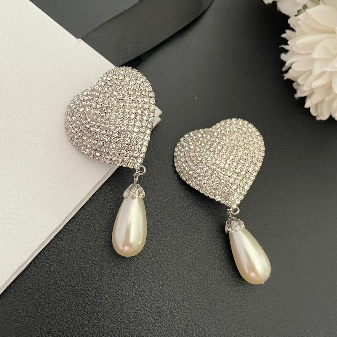 Orecchini cuore Qi qualità luce moda di lusso per le donne Aretes De Mujer Pendientes Boucle D'Oreille Orecchini Clip De Oreja