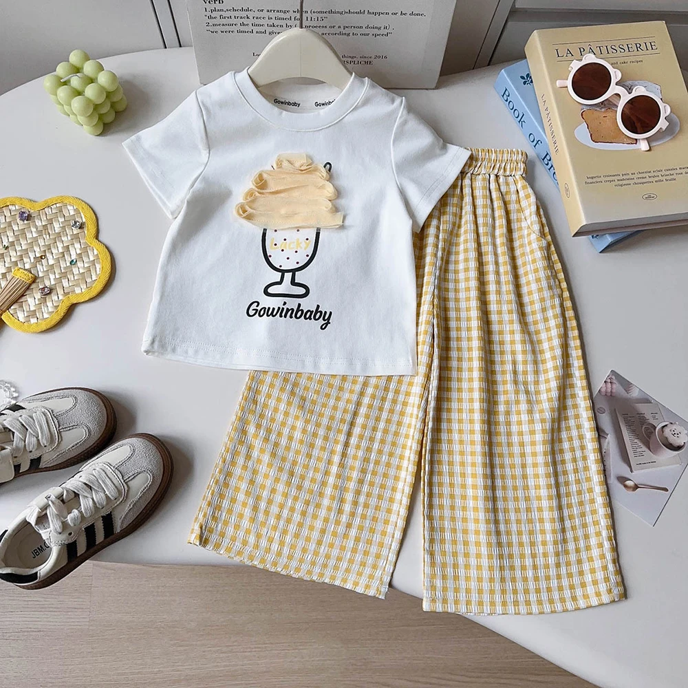 

Детский повседневный комплект одежды: летние футболки с принтом для девочек + свободные брюки в клетку, 2 предмета, новинка 2026 года, детские комплекты одежды для повседневной носки