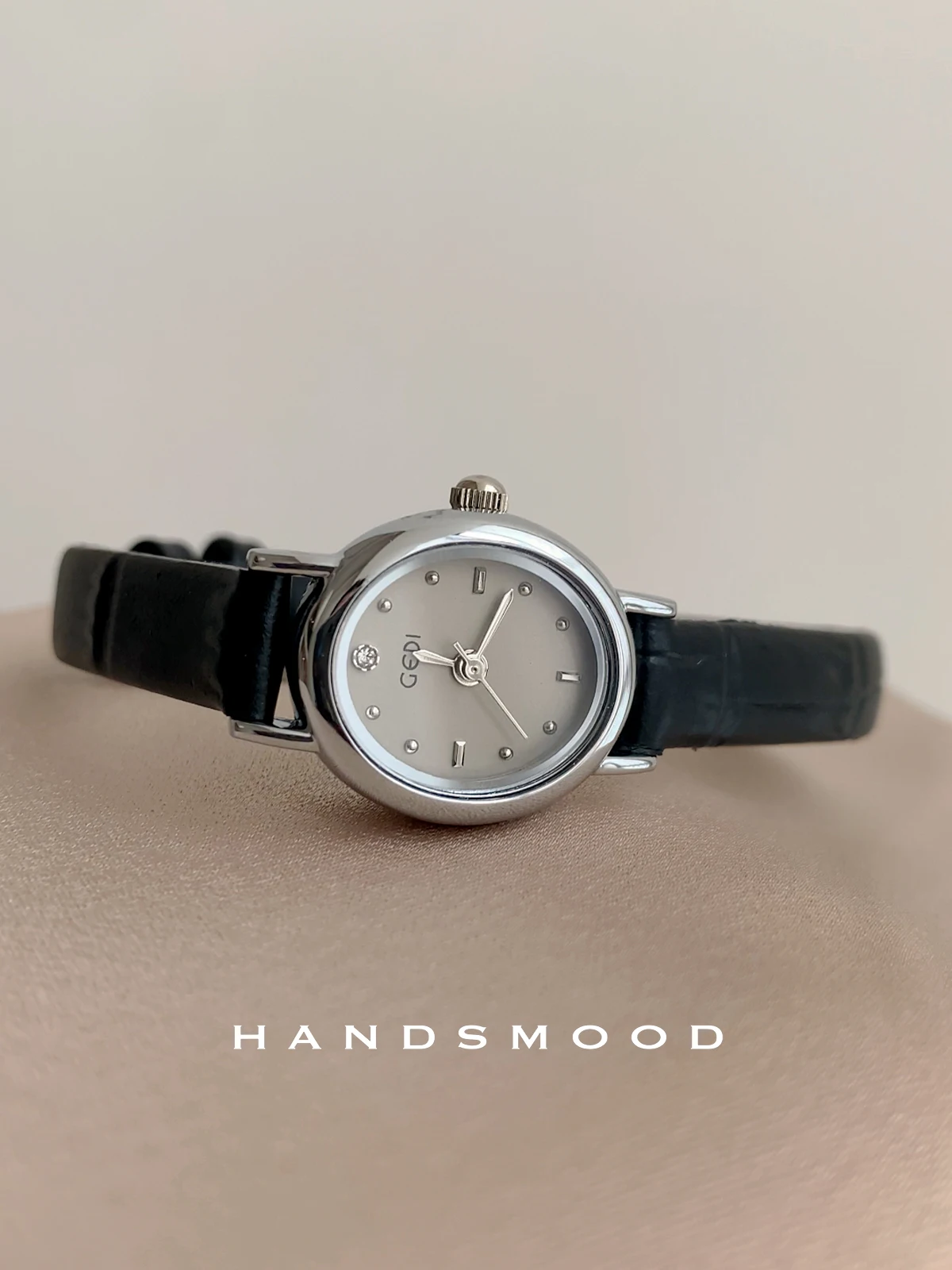 

A sophisticated and stylish leather women's watch with a black and gray oval dial; a perfect gift or accessory for women.