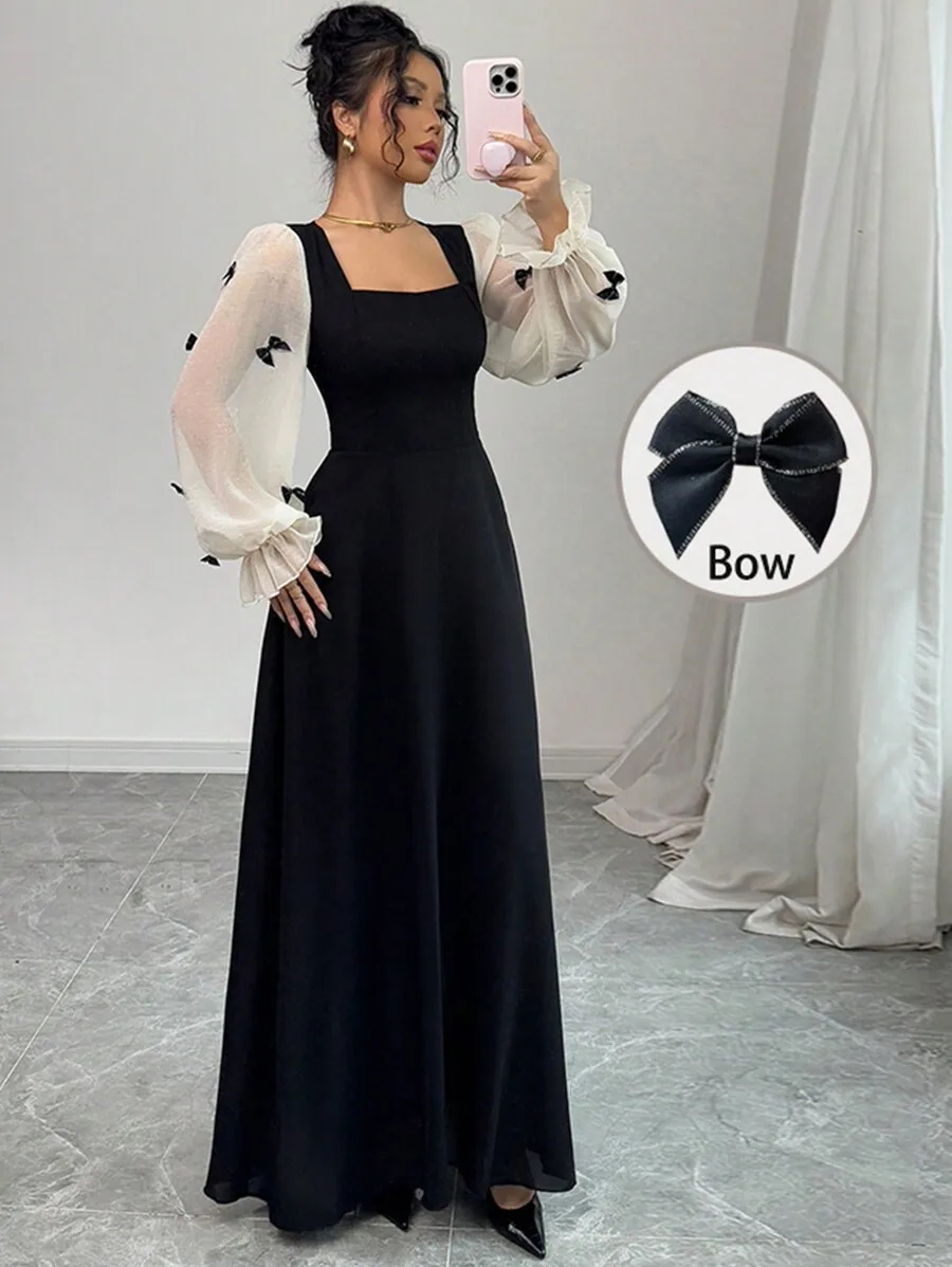 

Черное платье макси с квадратным вырезом, прозрачными пышными рукавами и бантом