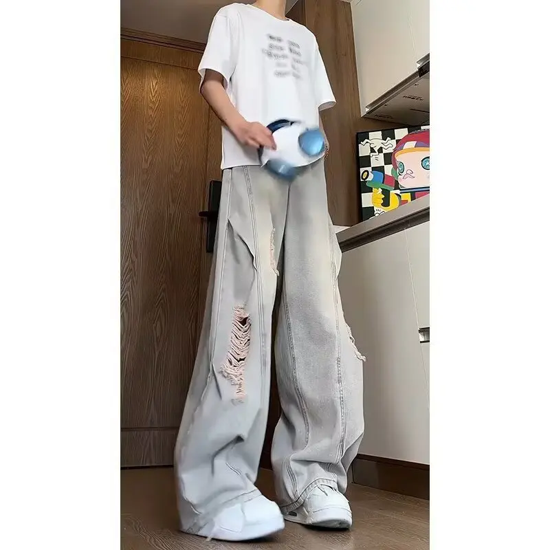 جينز ممزق مغسول باللون الأزرق للرجال صيفي أمريكي عالي الشارع فيبي سروال فضفاض واسع الساق