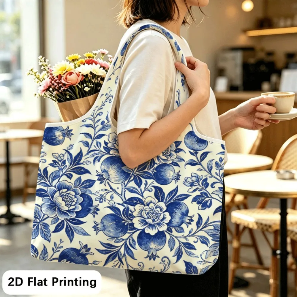 Blue Pomegranate Blossom Space‑saving foldable shoulder tote, must‑have for student trips.