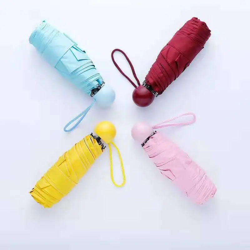 1Pc Mini Folding Umbrella Lovely Capsule Shape Umbrella Rain Sun Parasol Anti UV Small Pocket Umbrellas for Women Children