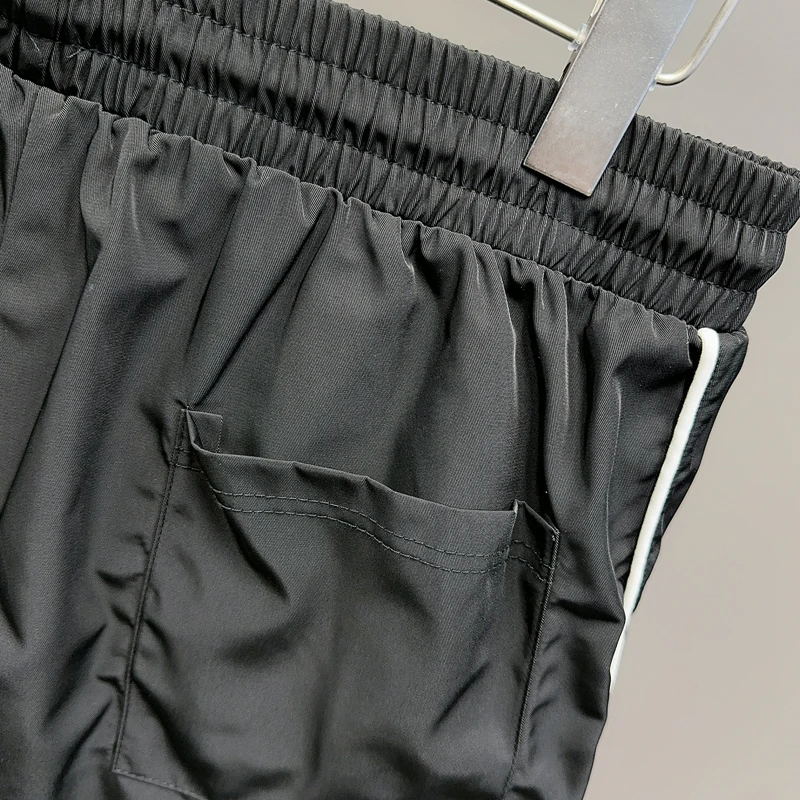 黒刺繍コスモススターリングバスケットボールショーツメッシュ速乾性 Jorts 男性女性ルーズ巾着ウインドブレーカースポーツショートパンツ