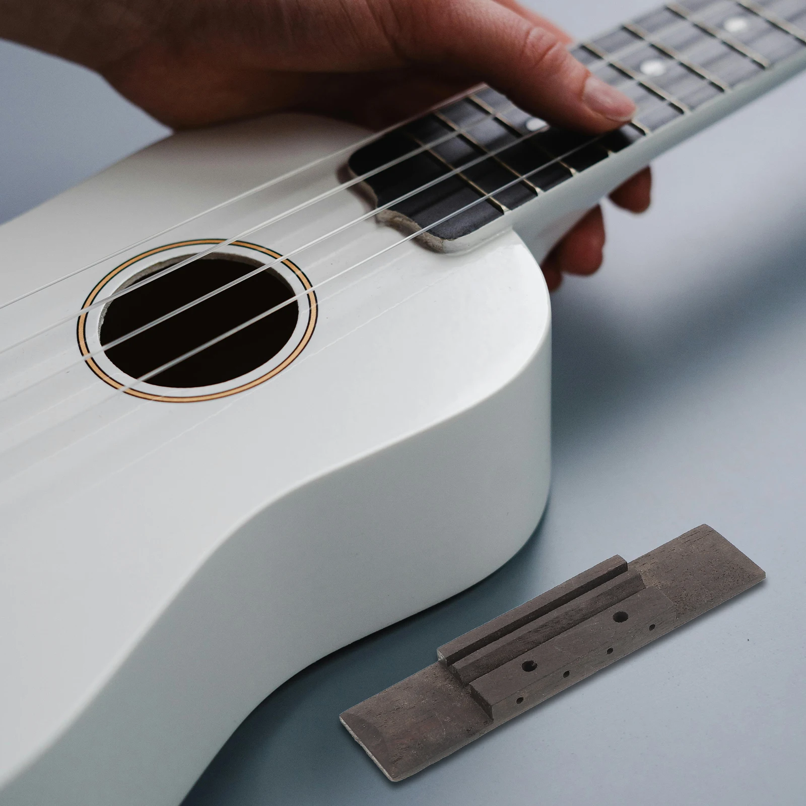 

Ukulele Bridge Rosewood Wooden Replacement Saddle Part for Guitar and String Instruments Smooth Functional Universal Luthier