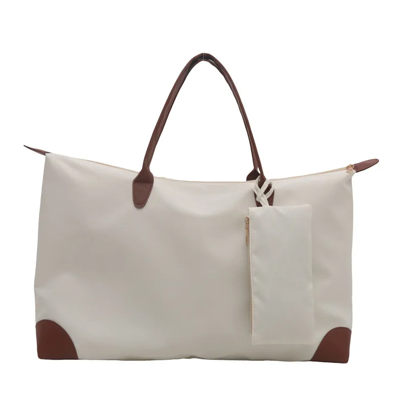 

Commuter tote bag female 2025 new senior sense of handheld travel dumpling bag fashion shoulder large capacity mommy bags