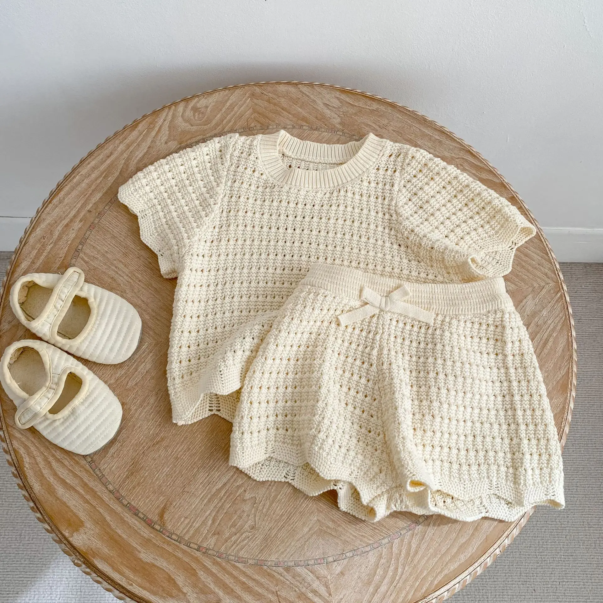 Trendy summer casual round neck knitted irregular short sleeved top paired with bow shorts two-piece set for children