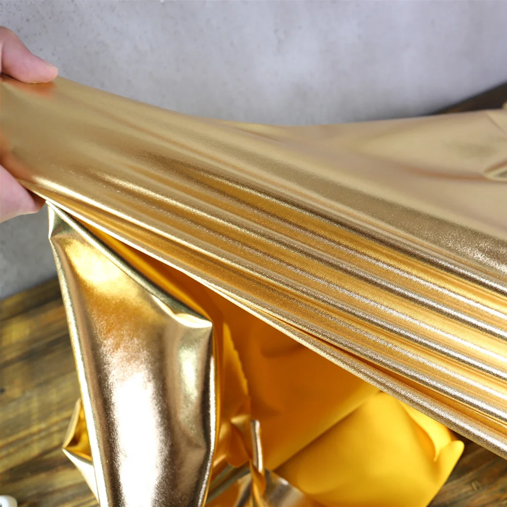 

100*145cm Shiny Metallic Spandex Stretch Fabric Mirror Glossy Soft Fabric For Upholstery Stage Show Dress Wedding Decor